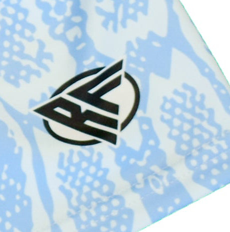 Close-up of RF-Wear women's snakeskin shorts in baby blue with RF logo