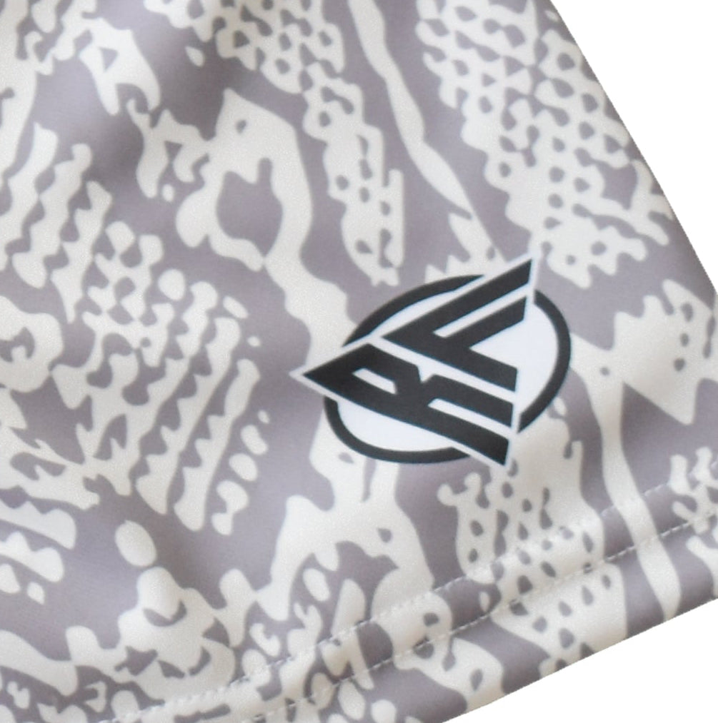 Close-up women's cream/grey snakeskin shorts