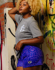 woman wearing RF-Wear Women's Snakeskin Shorts - Purple - Side View