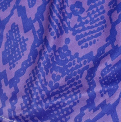 Close-up purple snakeskin shorts