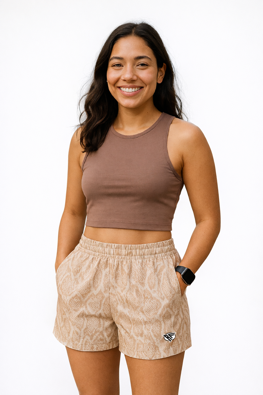 Woman wearing a brown shirt and RF-Wear Women's Snakeskin Shorts in Tan 