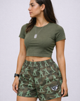 Woman wearing a green top and RF-Wear Women's Soldier Shorts in Camo Green