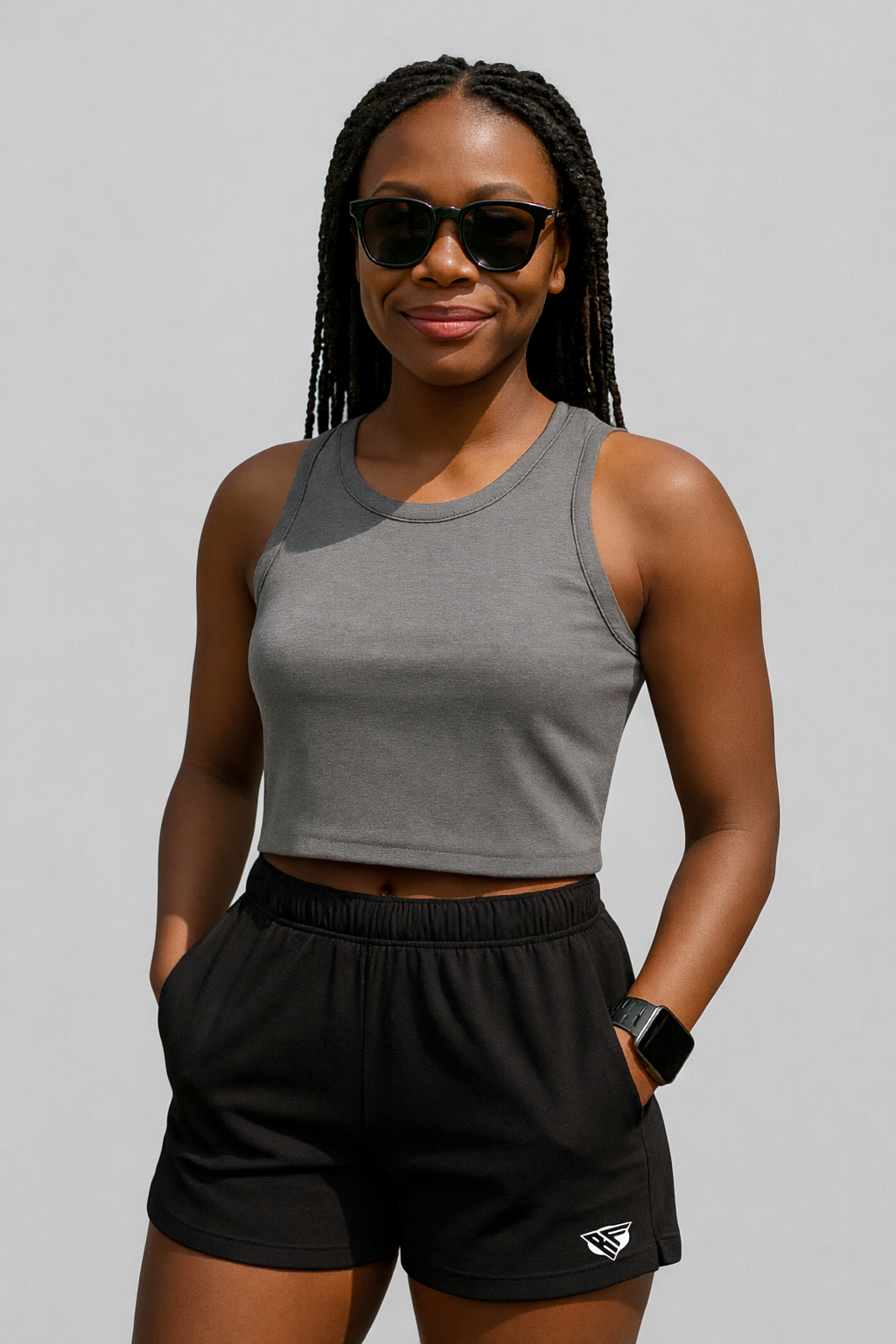 Woman wearing a grey top and RF-Wear Women's Solid Color Shorts in Black