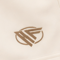 Close-up of RF-Wear Women's Solid Color Shorts in Cream with RF logo