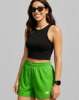 Woman Wearing a black top and RF-Wear Women's Solid Color Shorts in Lime-Green