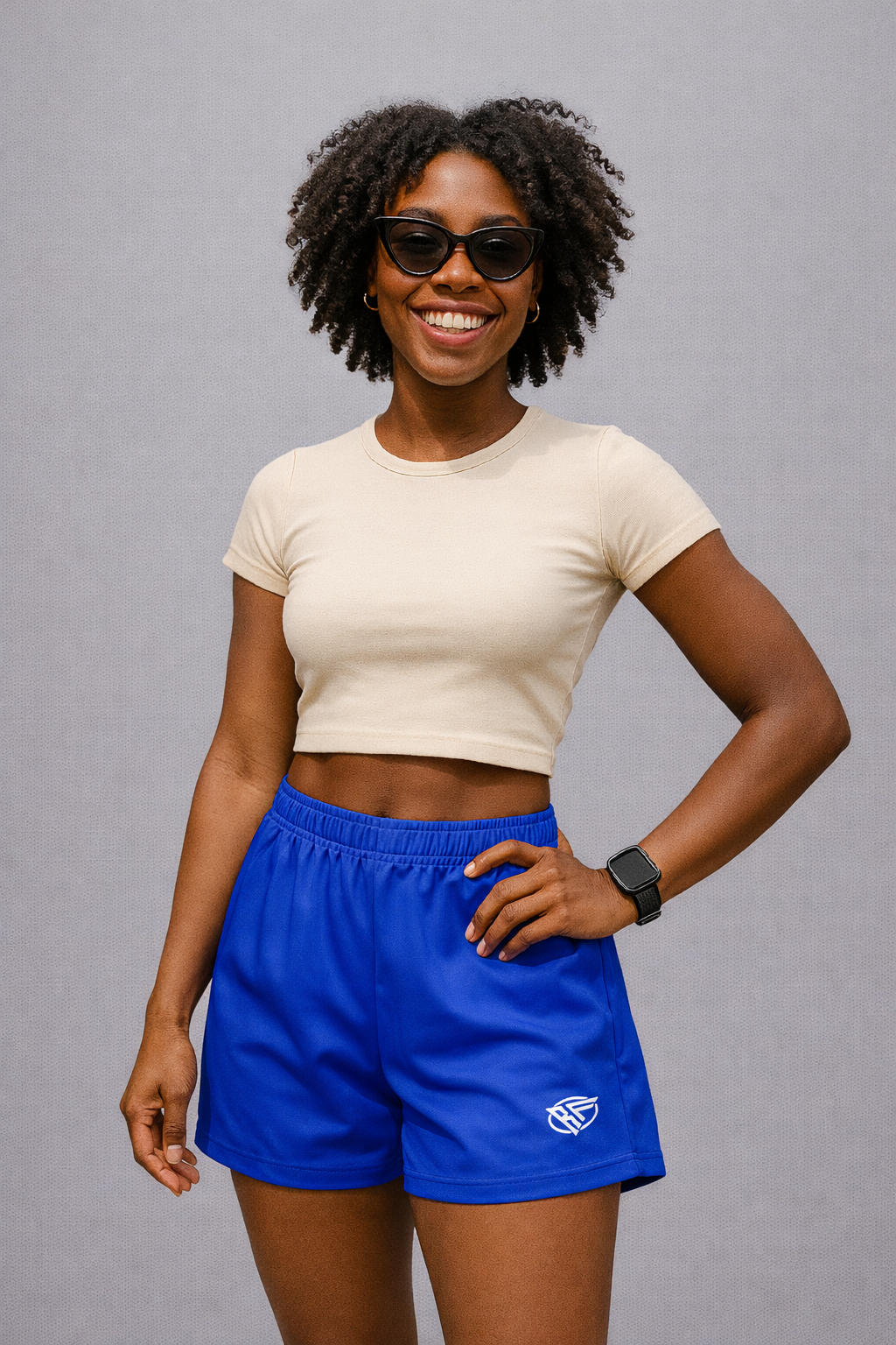 Woman wearing a white top and RF-Wear Women's Solid Color Shorts in Royal-Blue