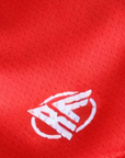 Close-up of RF-Wear Women's Solid Red Shorts in red with RF logo