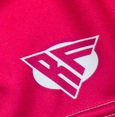 Close-up of RF-Wear Women's Split Flame Shorts in White/Hot Pink with RF logo