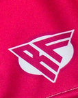 Close-up of RF-Wear Women's Split Flame Shorts in White/Hot Pink with RF logo