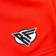 Close-up of RF-Wear Women's Split Flaming Pepper shorts in Red/Black with RF logo