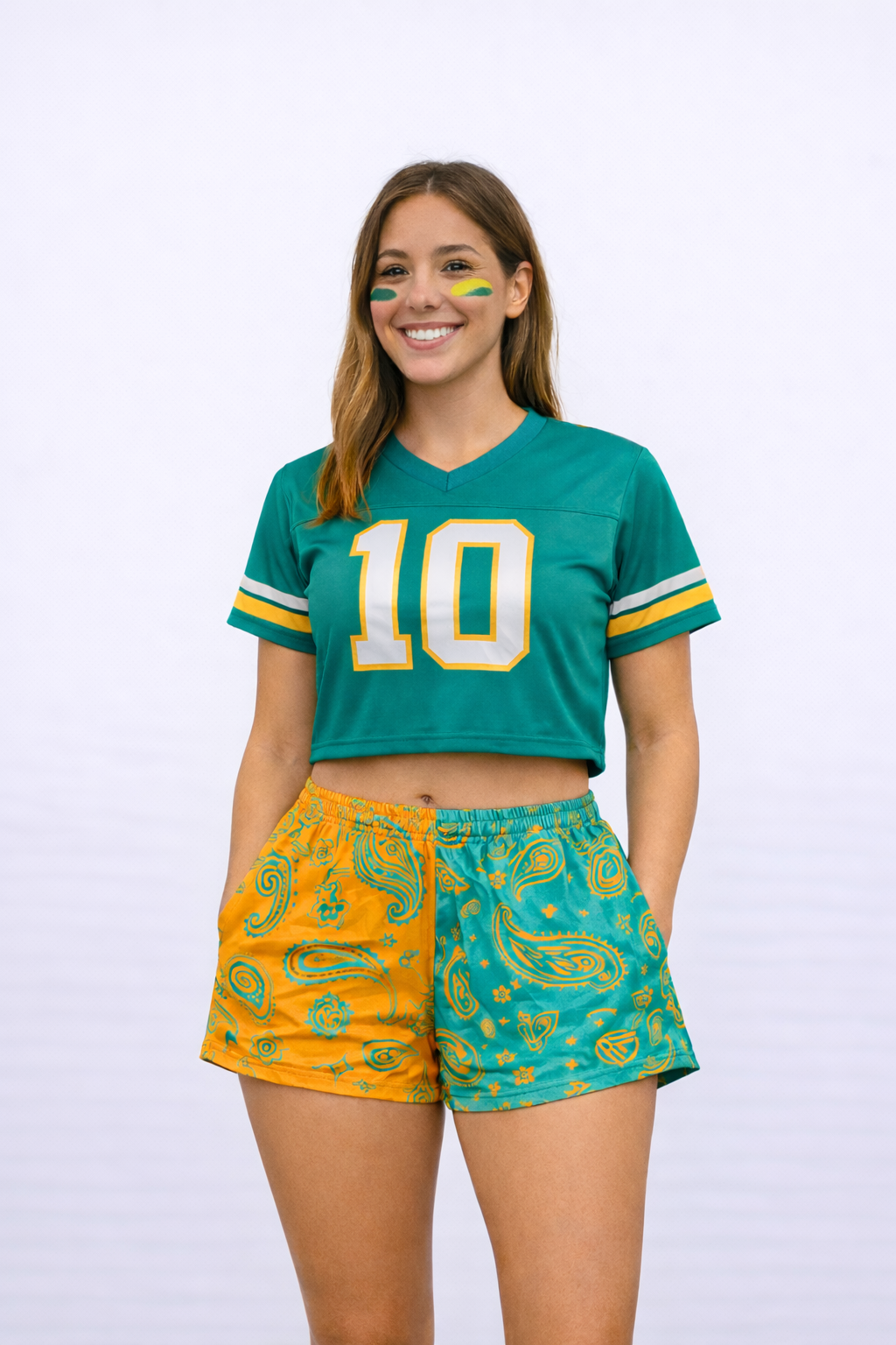 Woman wearing a jersey and RF-Wear Women's Split Paisley Shorts in Aqua/Orange