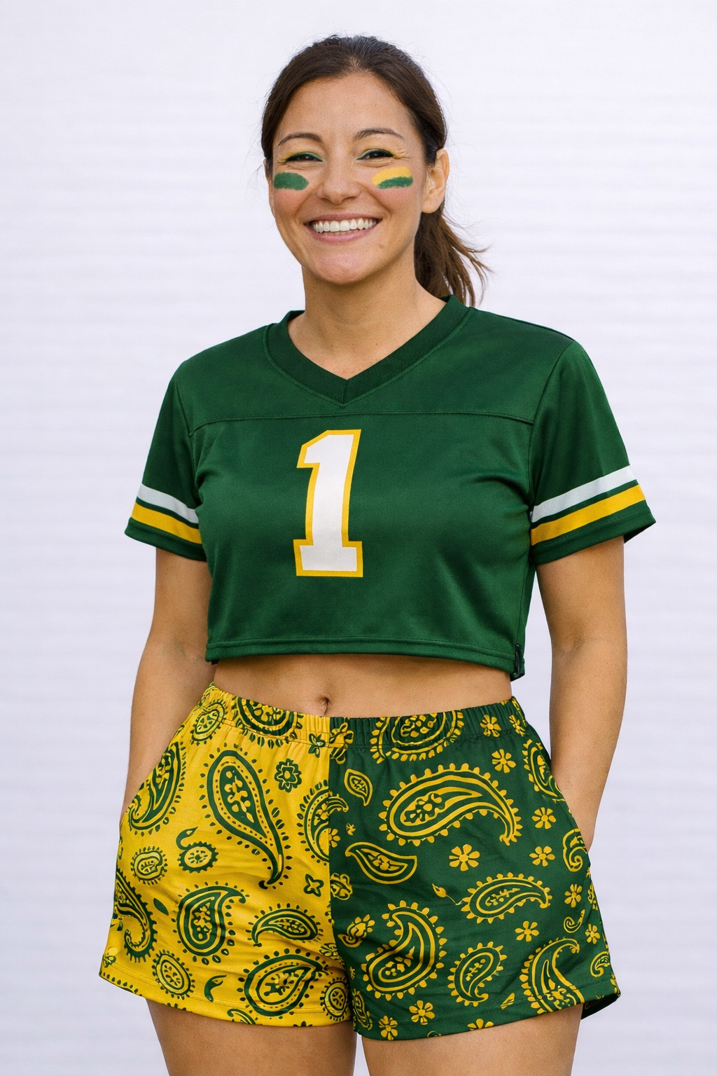 Woman wearing a green cropped jersey and RF-Wear Women's Split Paisley Shorts in Gold/Green