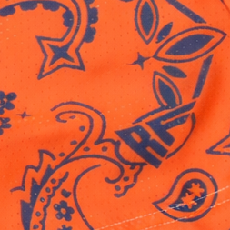 Close-up of RF-Wear Women's Split Paisley Shorts in Navy/Orange with RF logo