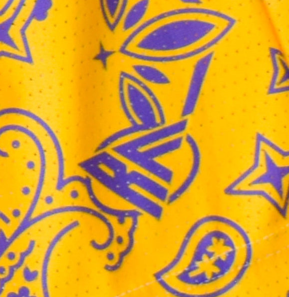 Close-up of RF-Wear Women's Split Paisley Shorts in Purple/Gold with RF logo