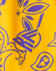 Close-up of RF-Wear Women's Split Paisley Shorts in Purple/Gold with RF logo