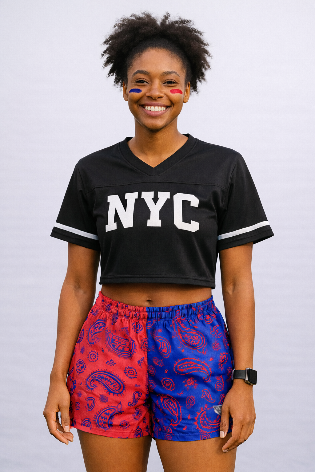 Woman wearing a black cropped top and RF-Wear Women's Split Paisley Shorts in Red/Blue