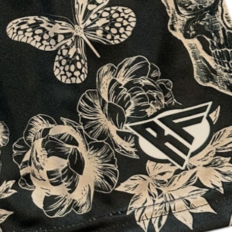 Close-up of RF-Wear Women's Split Skull Shorts in Cream/Black with RF logo