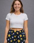 Woman wearing RF-Wear Women's Star Shorts in Yellow/White/Navy