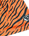 Close-up of RF-Wear Women's Animal Print Shorts - Tiger in Orange/Black with RF logo