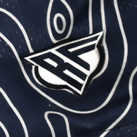 Close-up of RF-Wear Women's Topography Shorts in Navy/Cream with RF logo