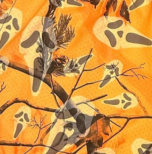 Close-up of RF-Wear Women's Tree Camo Ghost Faces Shorts in Orange