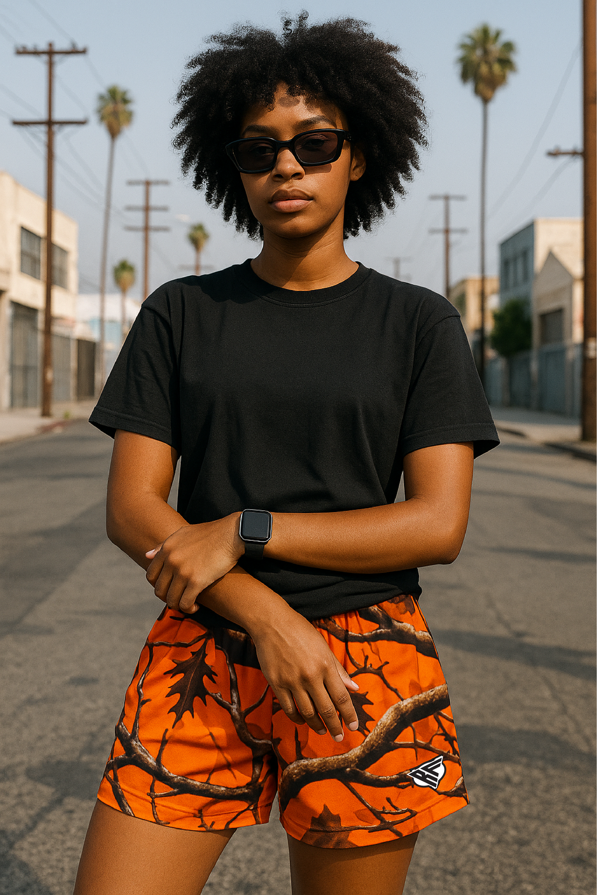 Woman wearing RF-Wear Women's Tree Camo Shorts - Orange - Front View