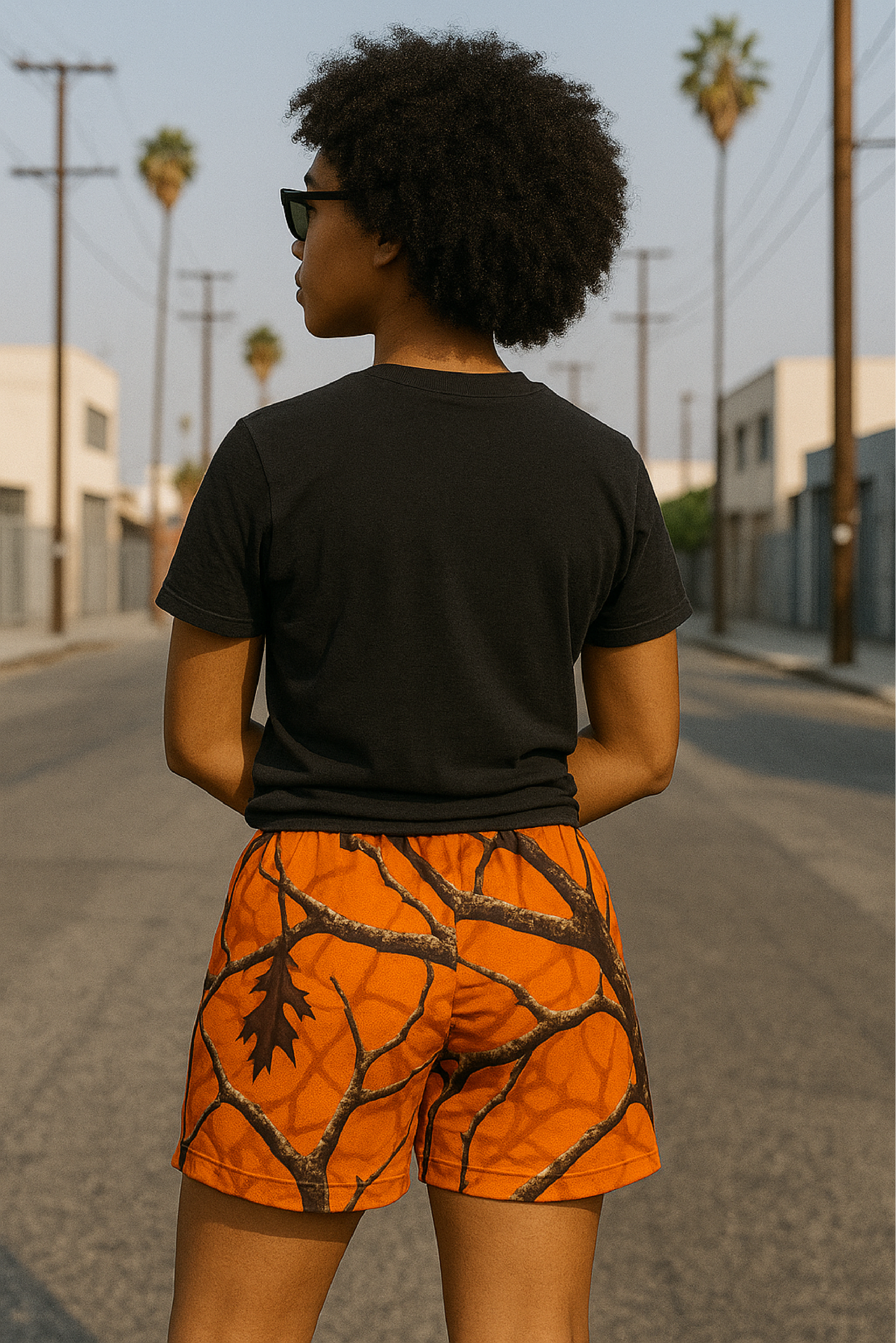 Woman wearing RF-Wear Women's Tree Camo Shorts - Orange - Back View