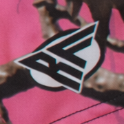 Close-up of RF-Wear Women's Tree Camo Shorts in Pink with RF logo