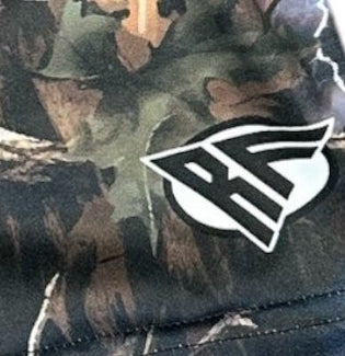 Close-up of RF-Wear Women's Tree Camo Shorts in  Storm with RF logo