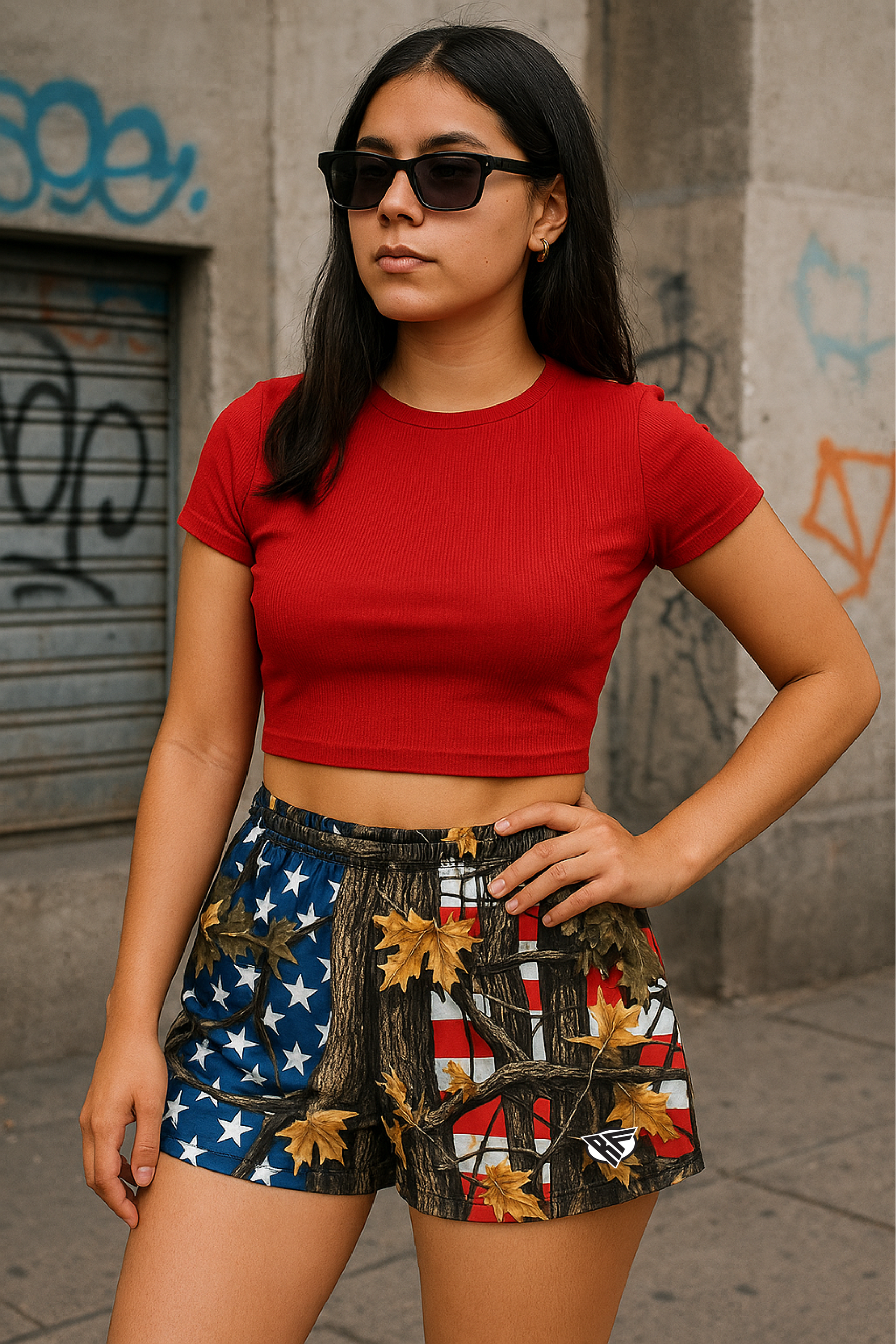 Woman wearing RF-Wear Women's Tree Camo Shorts - USA Flag - Front View