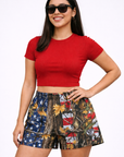 Woman wearing a red top and RF-Wear Women's Tree Camo Shorts - USA Flag 