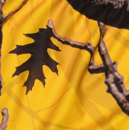 Close-up of women's tree camo shorts in yellow