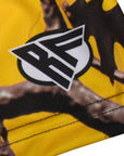 Close-up women's tree camo shorts in yellow with Brand Logo