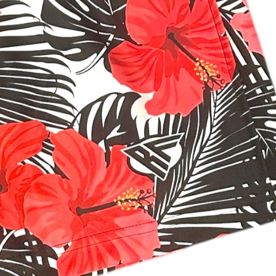 Close-up of RF-Wear Women's Tropical Flower - Coral on Black/White Shorts with RF logo