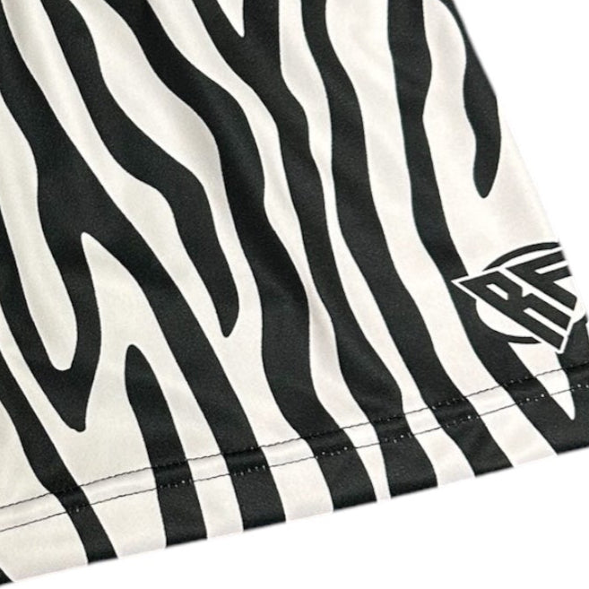 Close-up of RF-Wear Women's Animal Print Shorts - Zebra in Black/White with RF logo