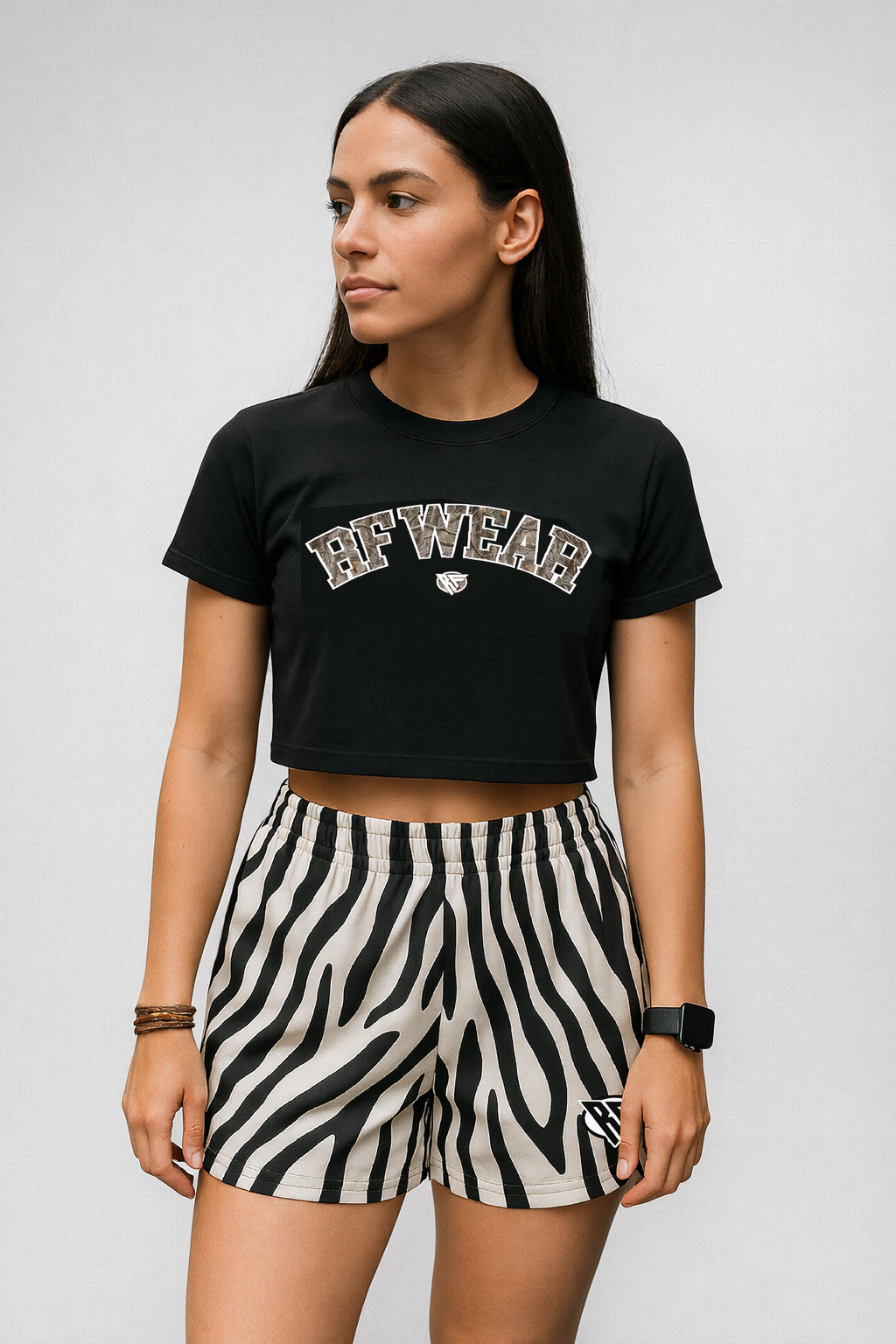 Woman wearing a black top and RF-Wear Women's Animal Print Shorts - Zebra in Black/White