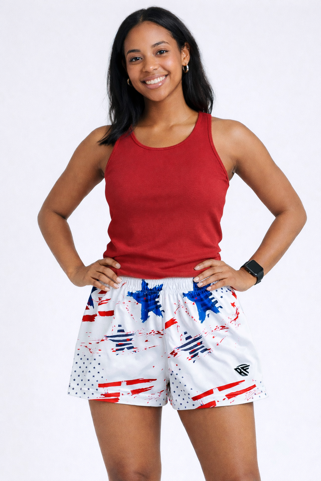Woman wearing a red top and RF-Wear Women's Patriotic Grunge Shorts in Red/White/Blue