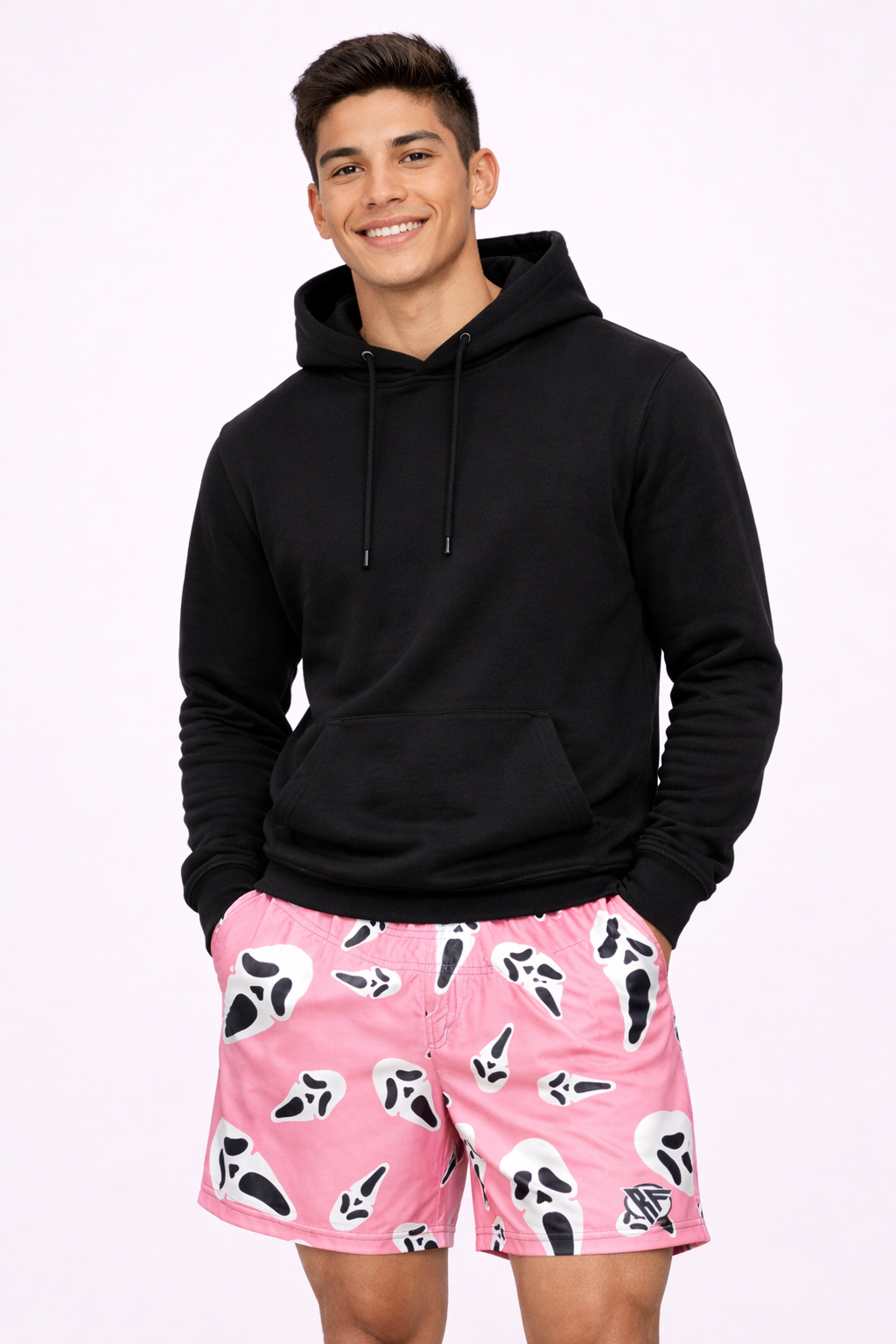 Man wearing a black hoodie and RF-Wear Men's Ghost Faces Shorts in Pink