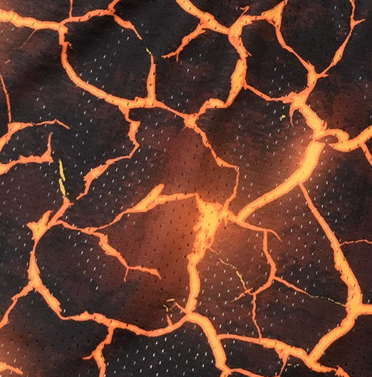 Close-up of RF-Wear Men's Mesh Lava Shorts in Black/Orange