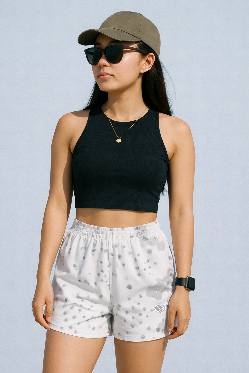 Woman wearing a black top with RF-Wear Women's Desert Camo Shorts in White/Grey 