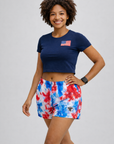Woman wearing navy top and RF-Wear  Women's Patriotic Tie Dye Shorts in Red/White/Blue