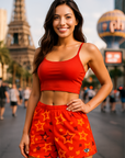 Woman wearing a red tank top with star pattern shorts, on Vegas Strip. 