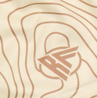 Close-up of RF-Wear Women's Topography Shorts in Cream/Tan with RF logo
