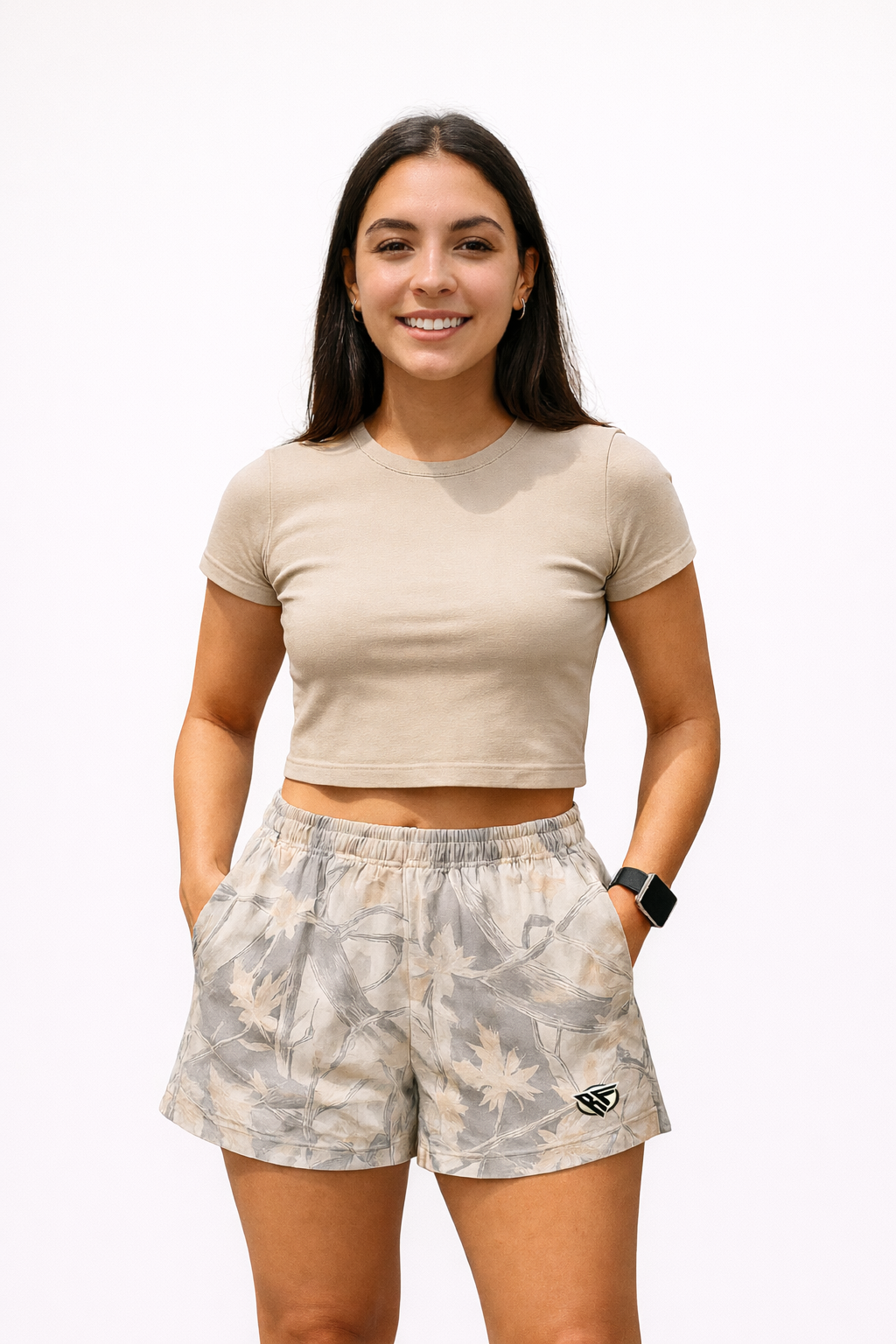 Woman wearing a beige top and RF-Wear Women's Tree Camo Shorts in Cream/Grey 