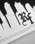 Close-up of RF-Wear Mesh Skyline Shorts in Black/White with RF logo
